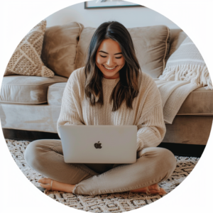 a woman sitting with a laptop